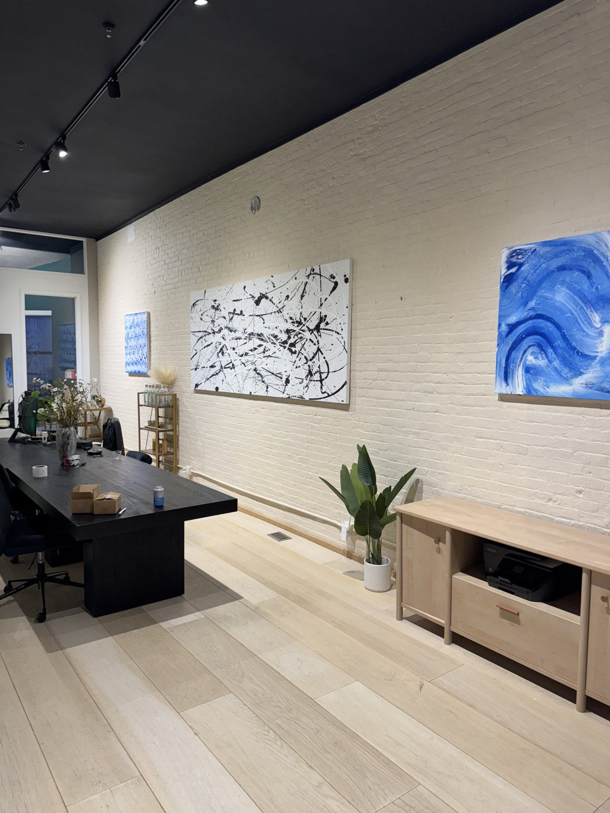 Two works, in the Mezcalum office